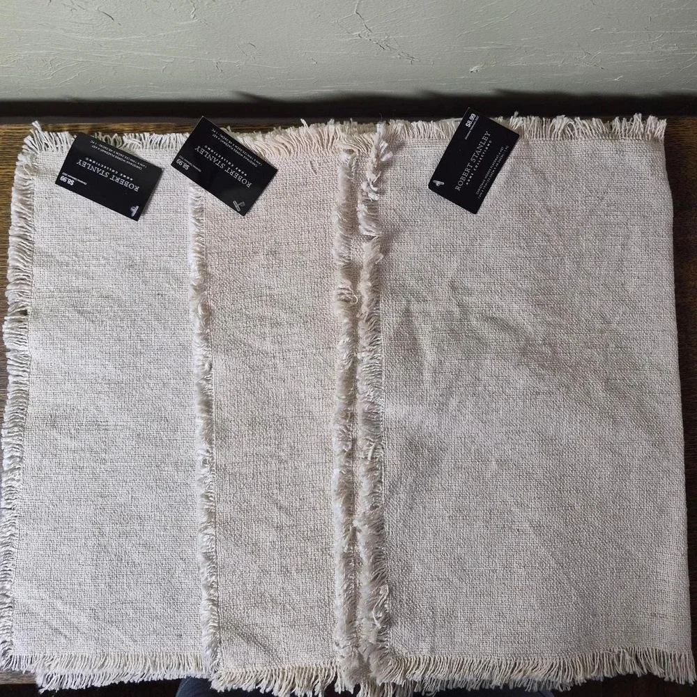 Cream Holiday Placemats (three total) - with the words 'jingle, jolly, & cheer'